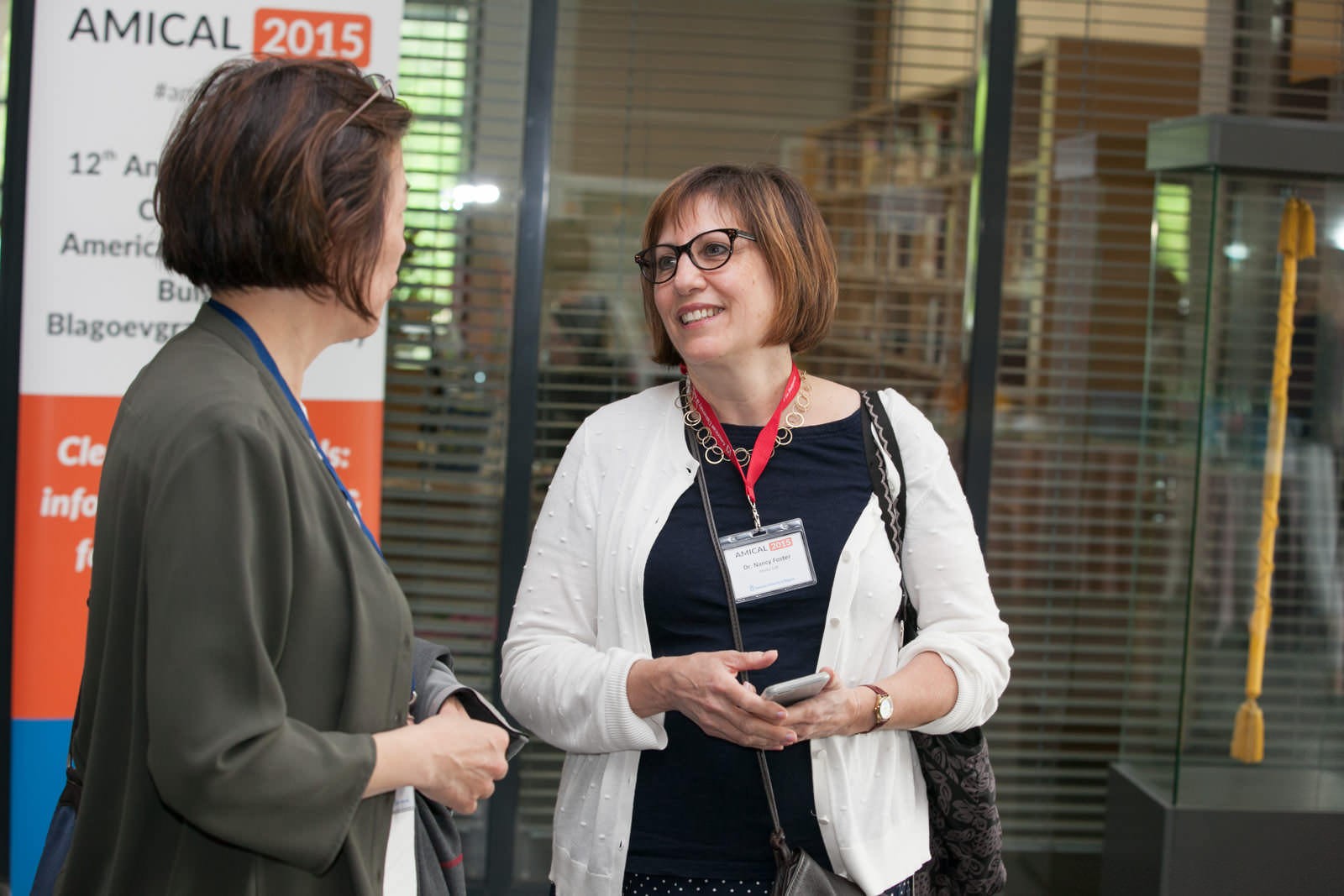 Nancy Fried Foster talking with Margaret Kneller.